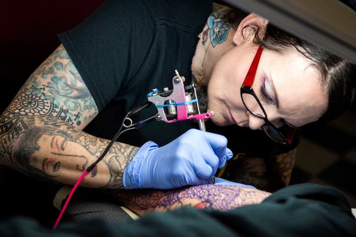 experienced tattoo artist in a studio