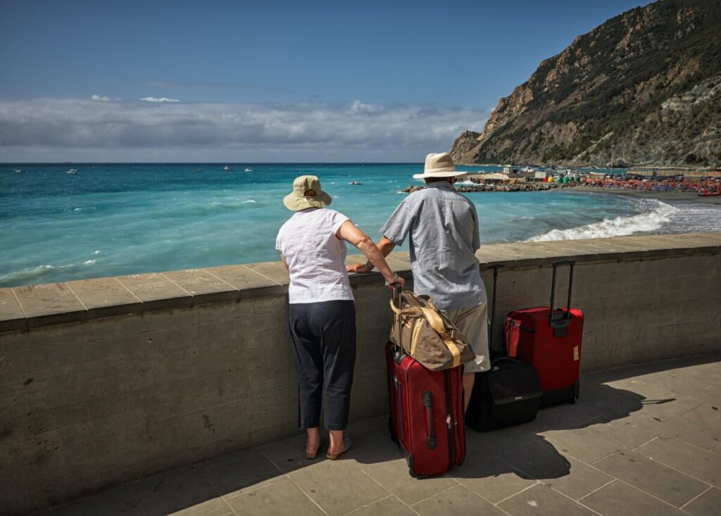 an elderly couple traveling to a foreign country